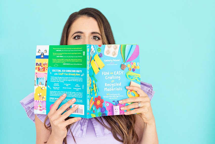 Kimberly behind a book